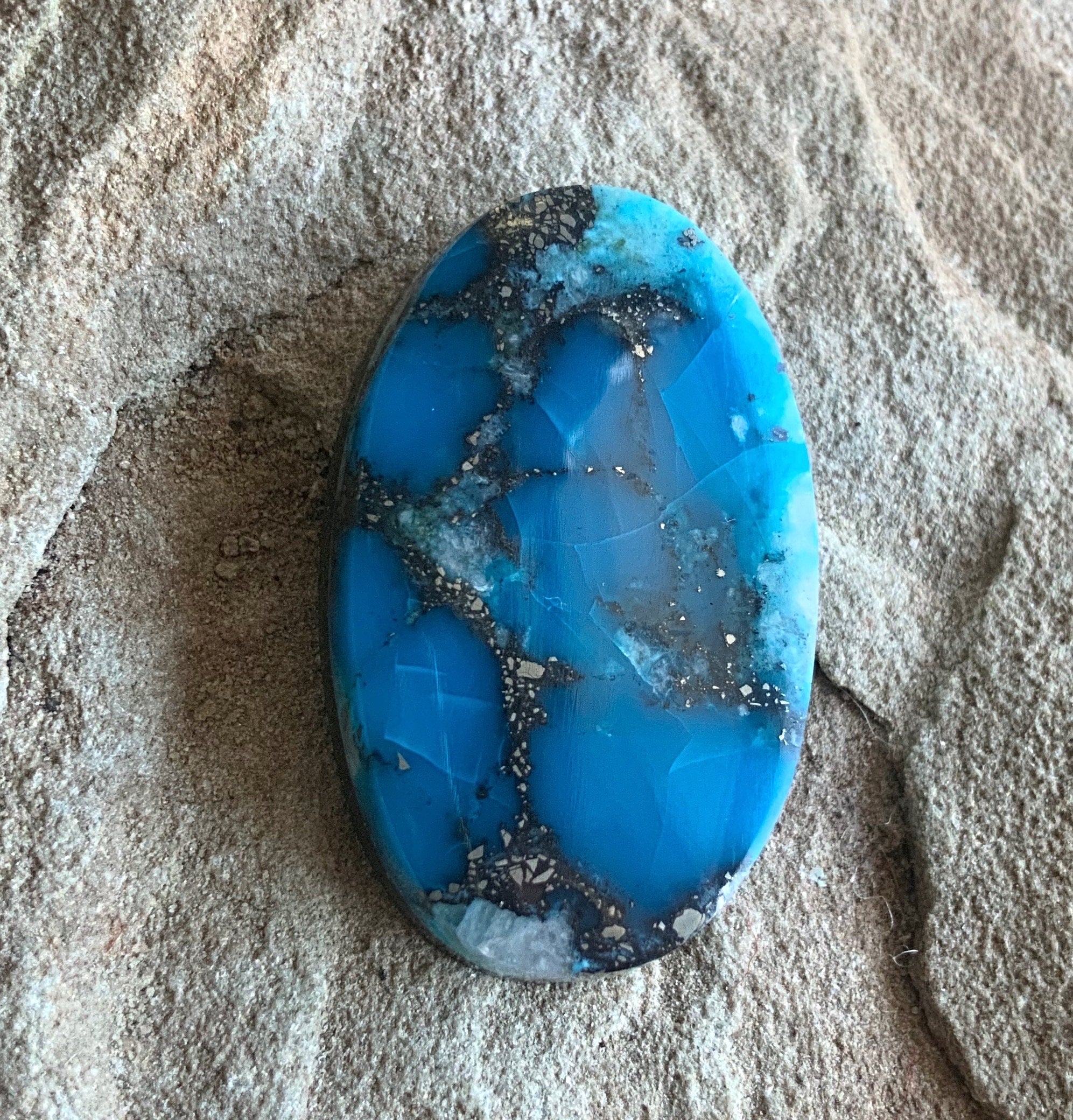 High Grade Ithaca Peak Turquoise Oval Cabochon With Quartz & Pyrite Inclusions