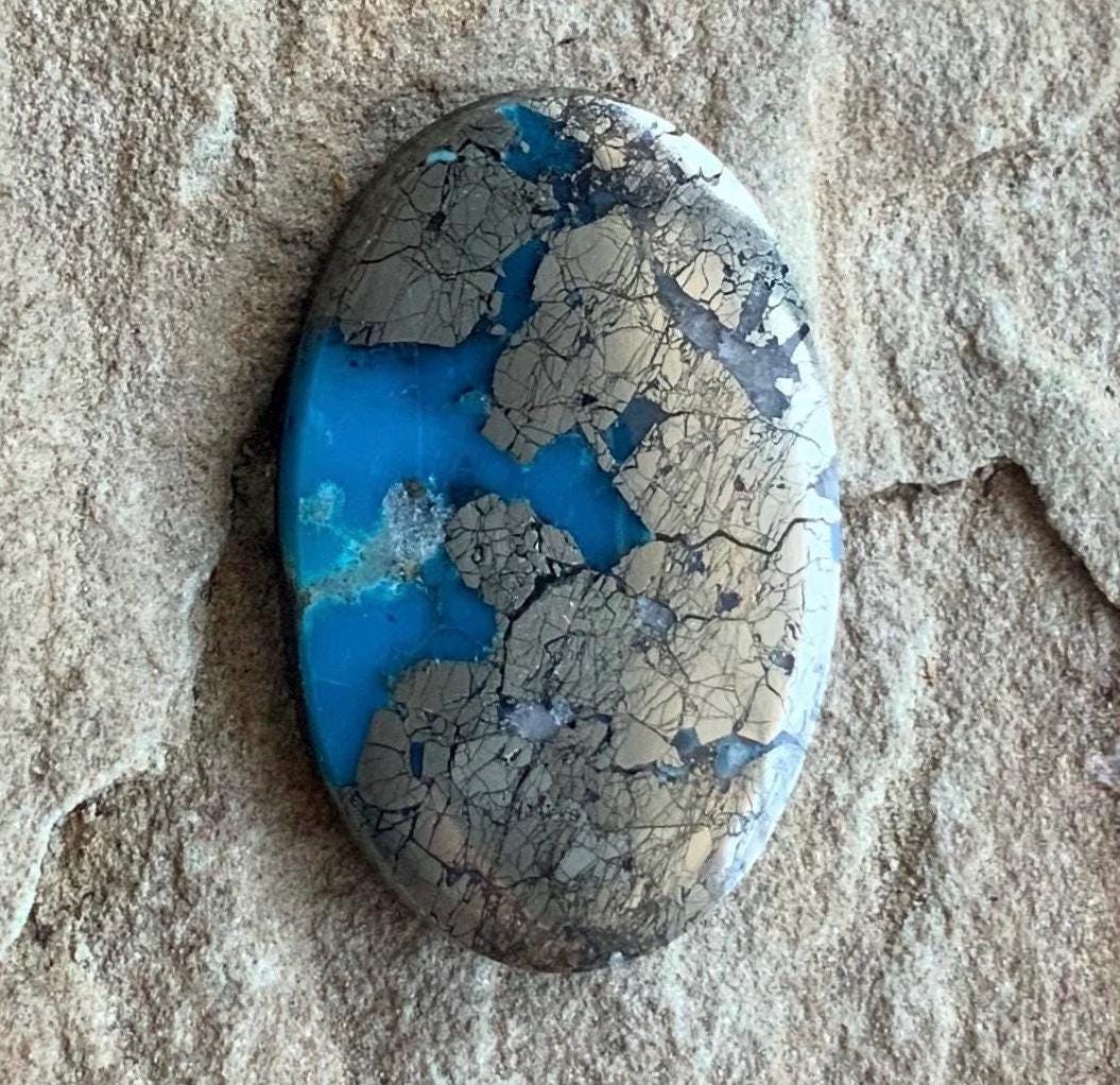 Ithaca Peak Turquoise High Grade Oval Cabochon Loaded With Silver Pyrite IP116
