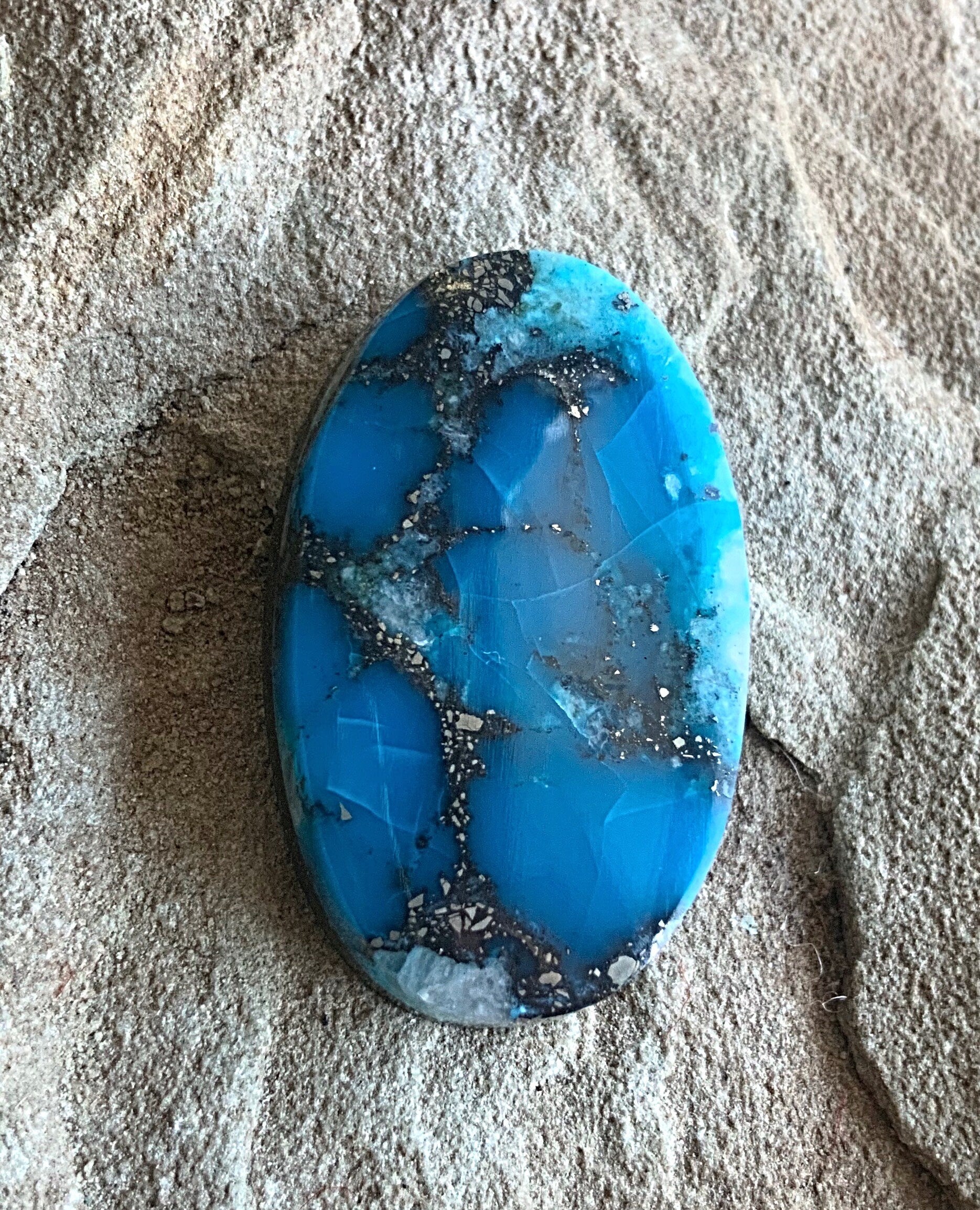 High Grade Ithaca Peak Turquoise Oval Cabochon With Quartz & Pyrite Inclusions
