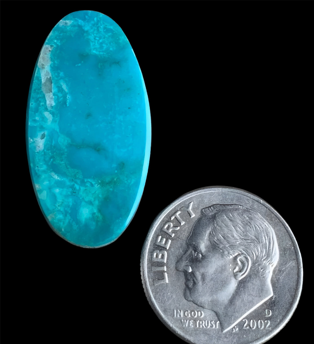 Turquoise Mountain Turquoise Oval Cabochon With Quartz Inclusions