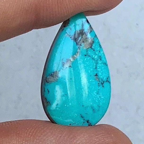 High Grade Ithaca Peak Turquoise Teardrop Cabochon With Quartz Inclusions