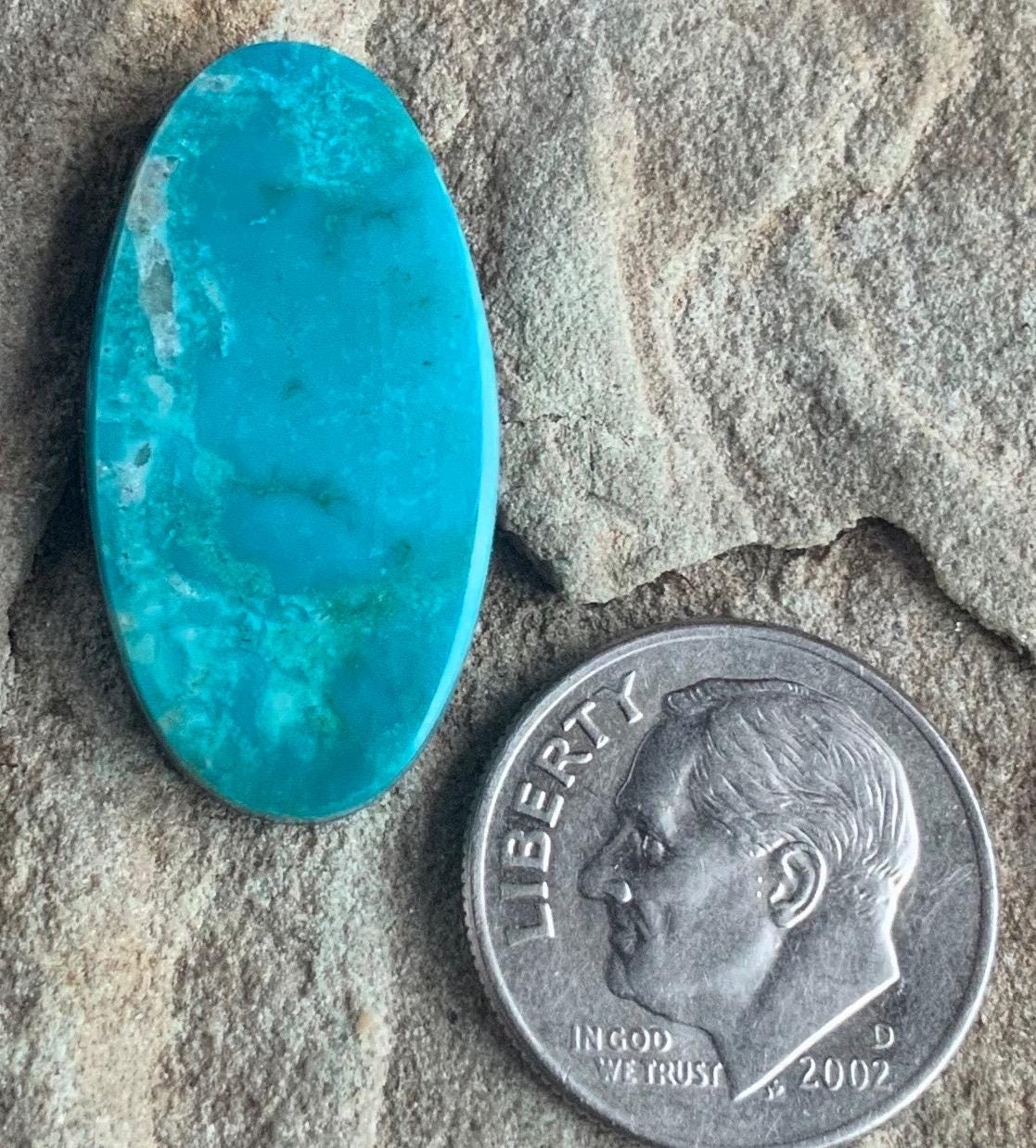 Turquoise Mountain Turquoise Oval Cabochon With Quartz Inclusions