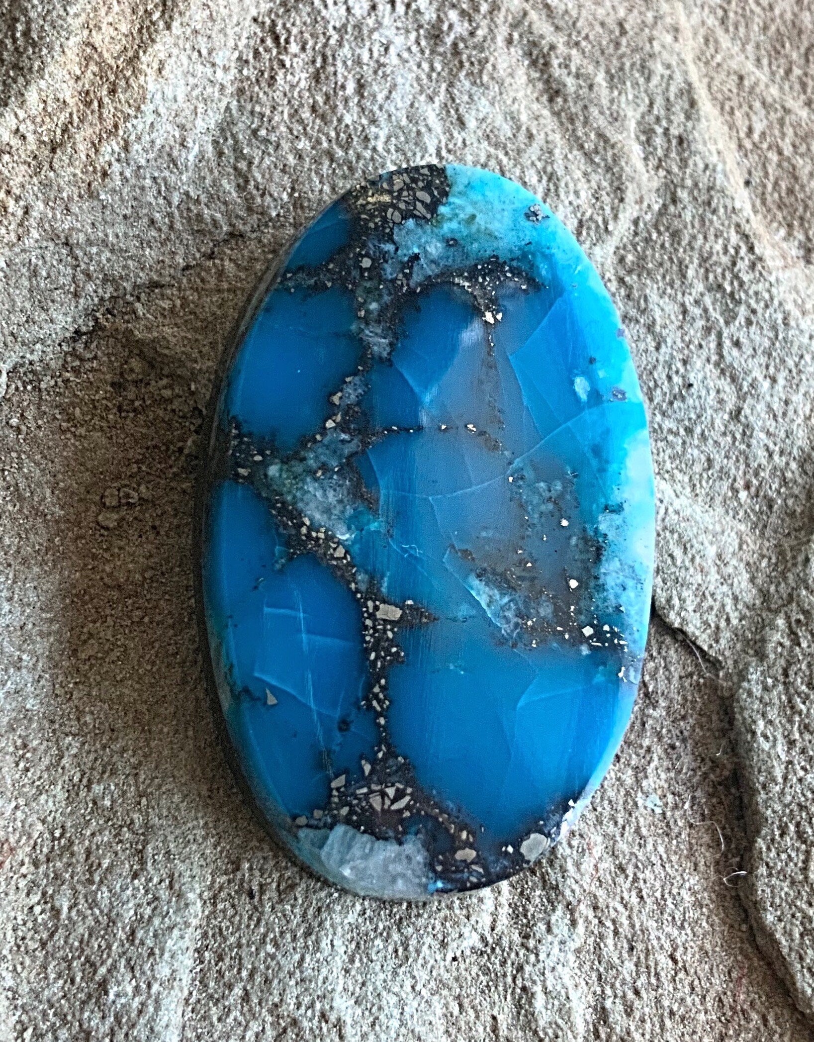 High Grade Ithaca Peak Turquoise Oval Cabochon With Quartz & Pyrite Inclusions