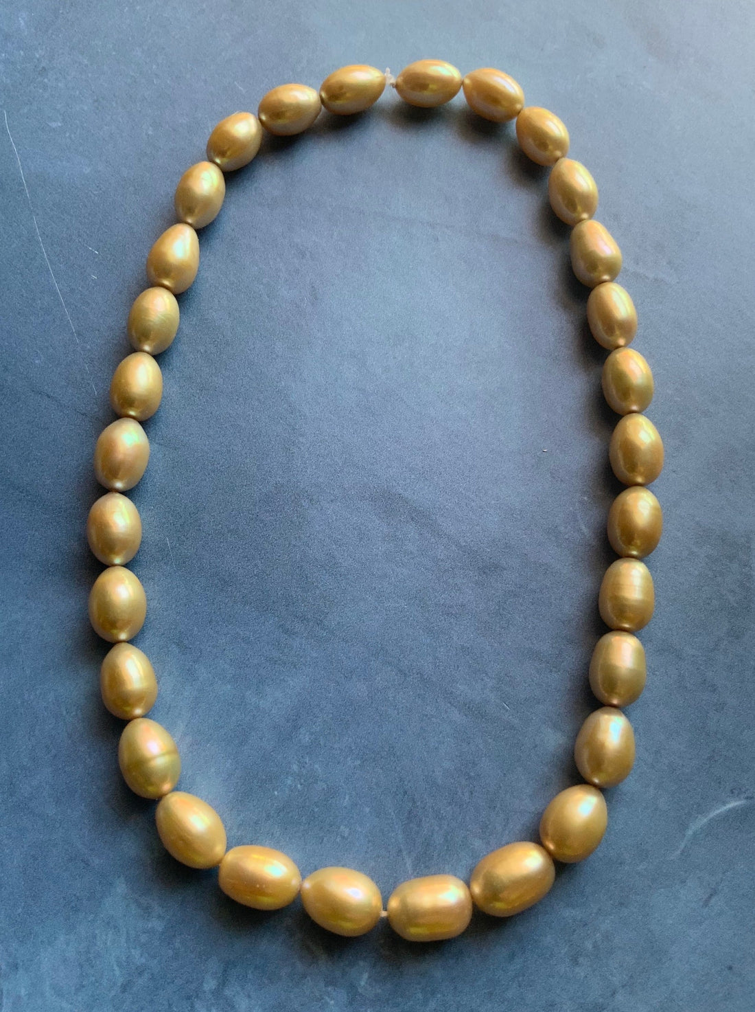 Beautiful Large AAA Large Champagne Gold Oval Rice Shaped Freshwater Pearl Strand