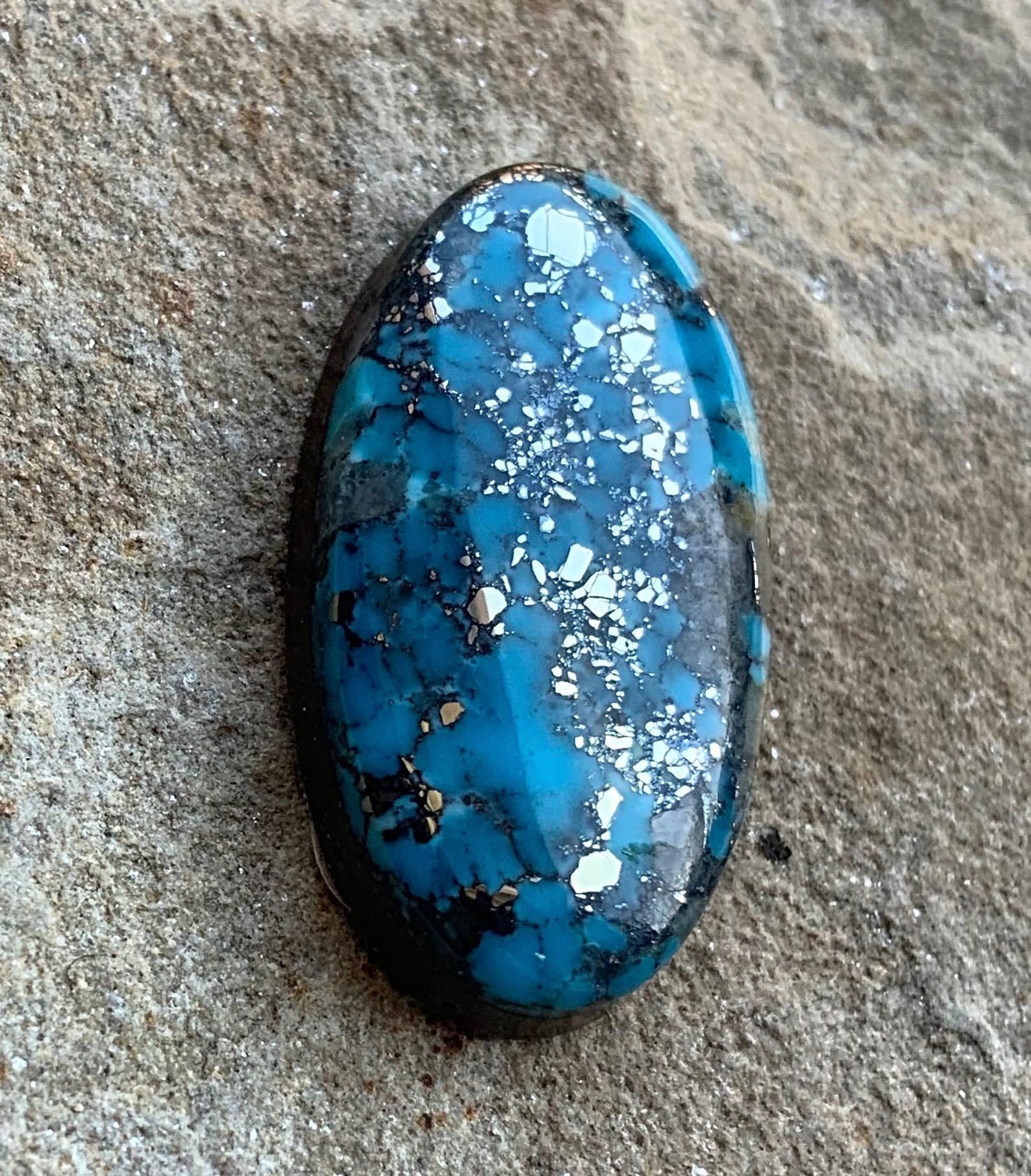 Ithaca Peak High Grade Turquoise Oval Cabochon With Silver Pyrite & Quartz Inclusions