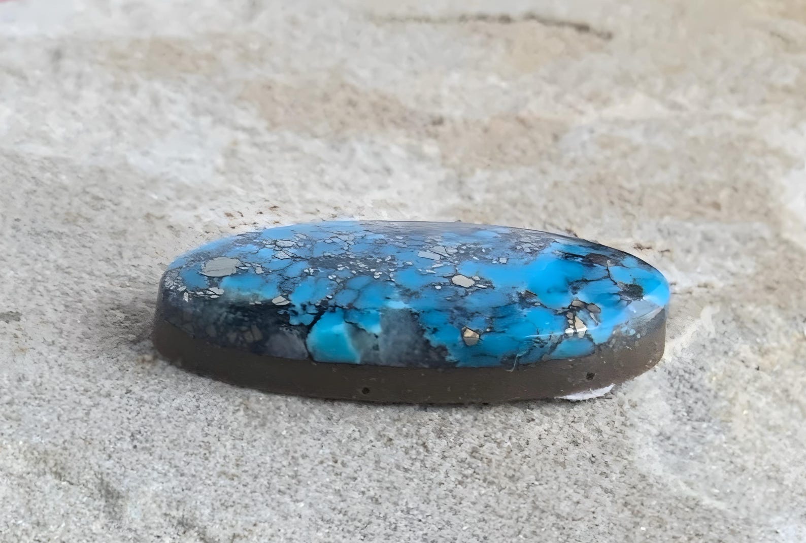 Ithaca Peak High Grade Turquoise Oval Cabochon With Silver Pyrite & Quartz Inclusions