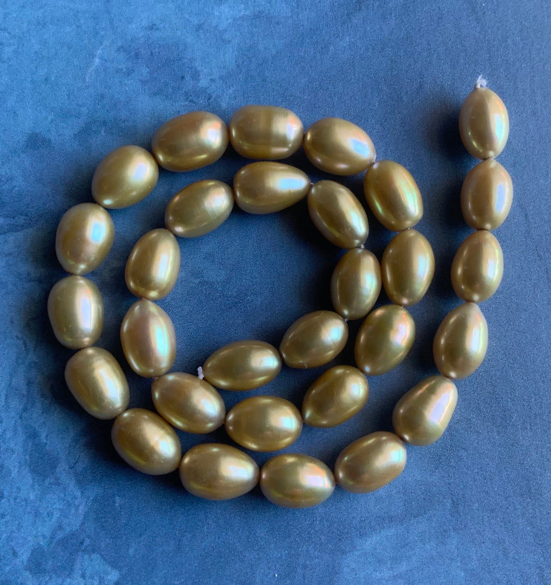 Beautiful Large AAA Large Champagne Gold Oval Rice Shaped Freshwater Pearl Strand
