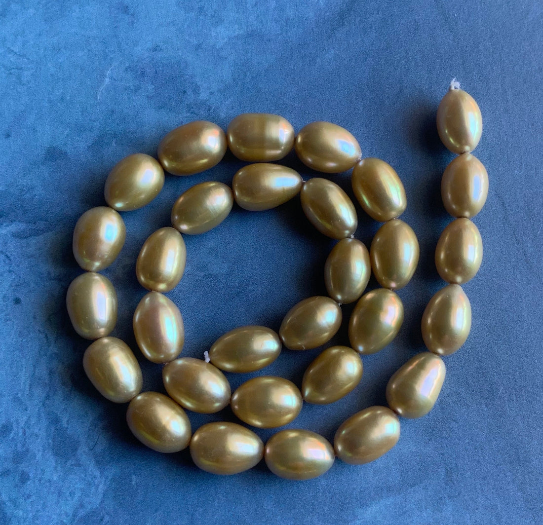 Beautiful Large AAA Large Champagne Gold Oval Rice Shaped Freshwater Pearl Strand